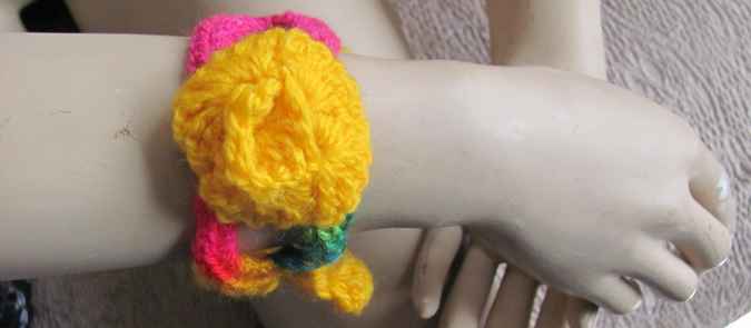 large image of art item: accessory – bracelet crochet flower yellow pink
