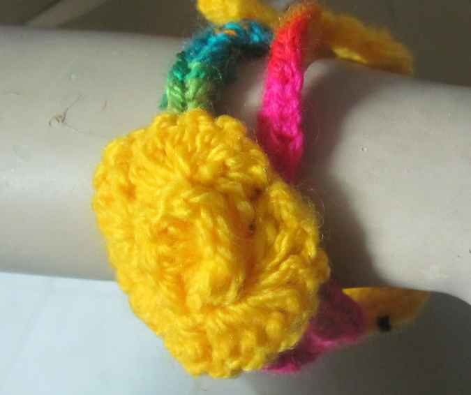 large image of art item: accessory – bracelet crochet flower yellow pink
