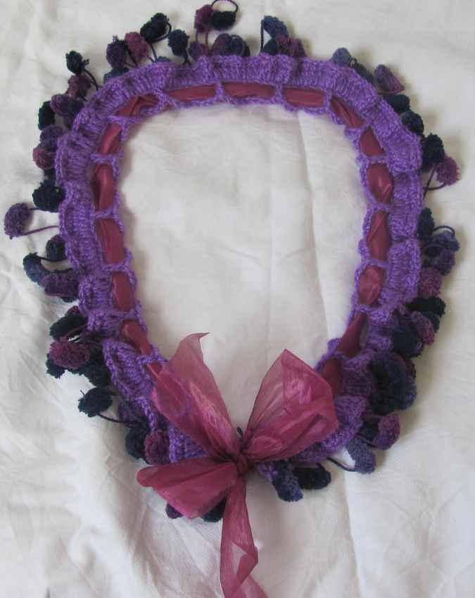 large image of art item: accessory – crochet purple ponpons ribbon