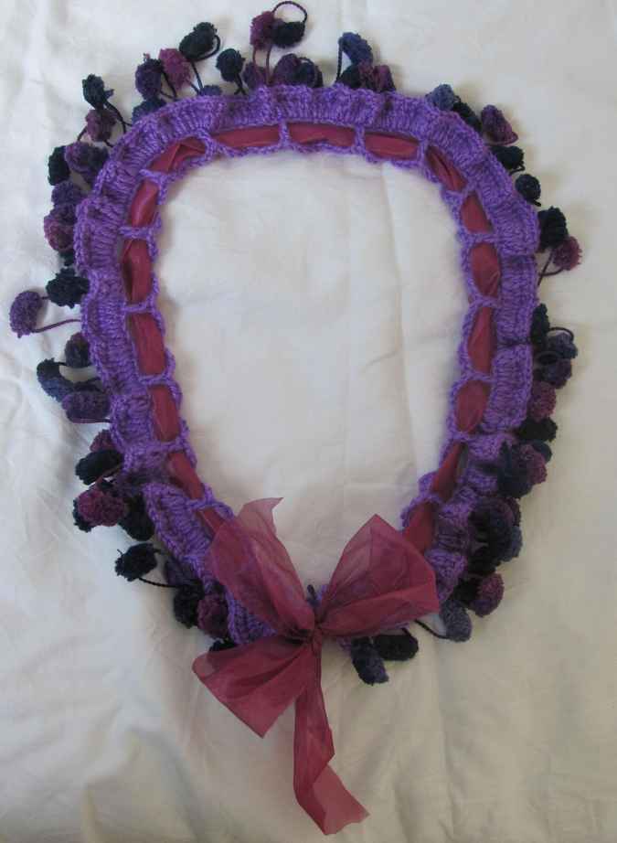 large image of art item: accessory – crochet purple ponpons ribbon