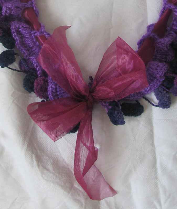 large image of art item: accessory – crochet purple ponpons ribbon