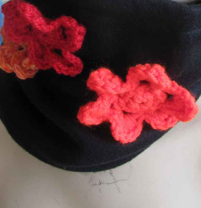 large image of art item: accessory – black hat/scarf with red crochet flowers