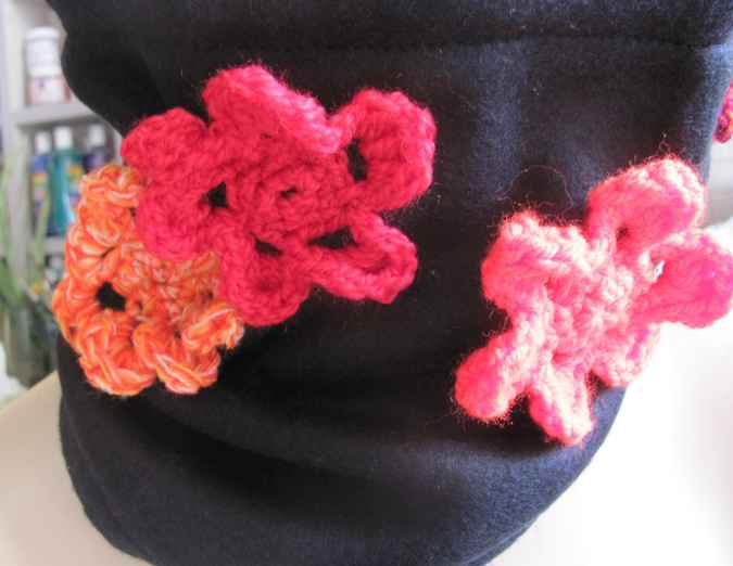 large image of art item: accessory – black hat/scarf with red crochet flowers