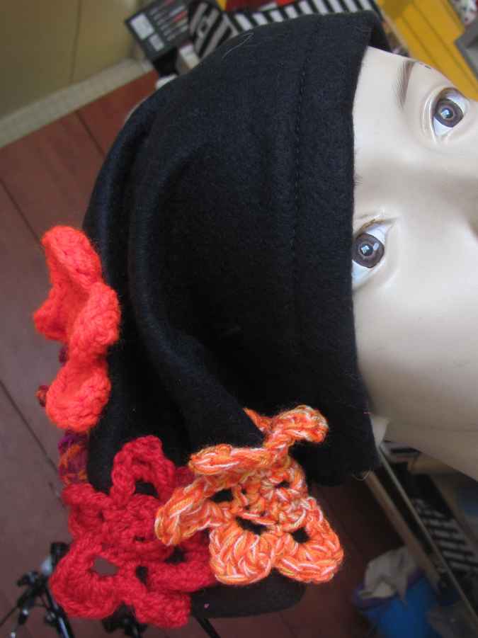 large image of art item: accessory – black hat/scarf with red crochet flowers