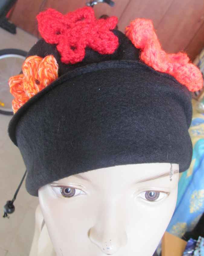 large image of art item: accessory – black hat/scarf with red crochet flowers
