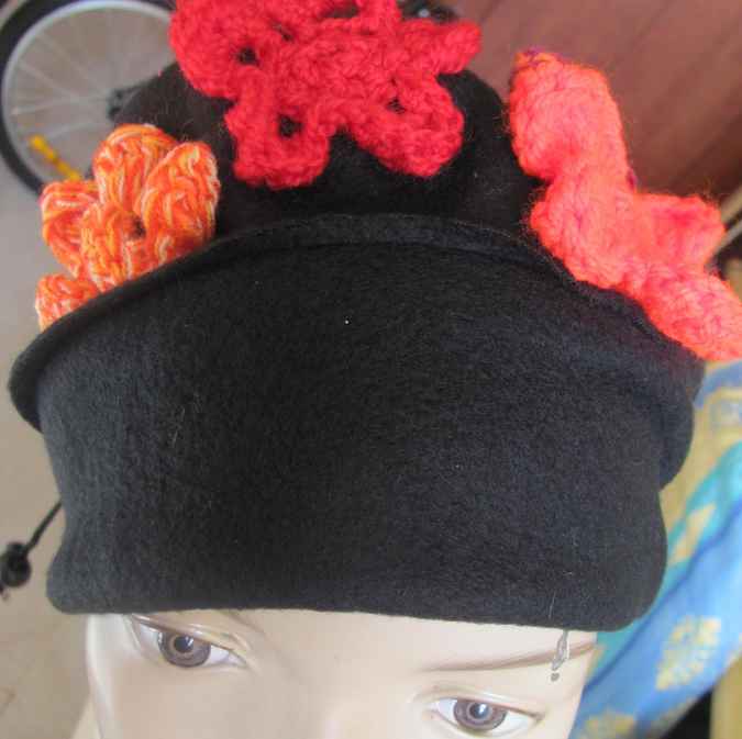 large image of art item: accessory – black hat/scarf with red crochet flowers