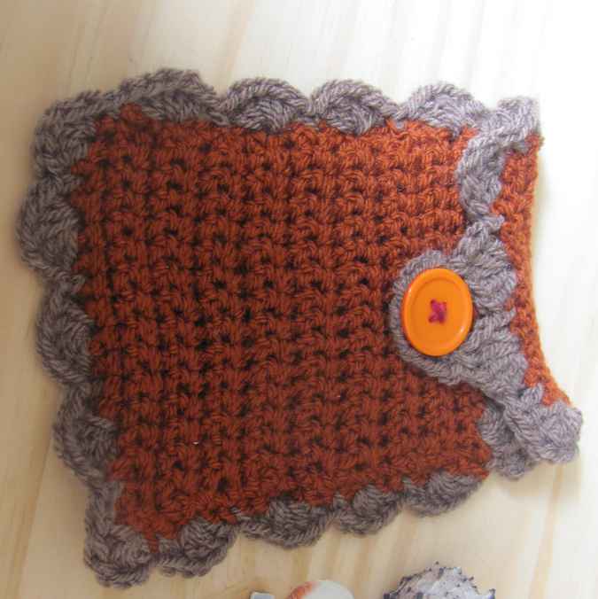 large image of art item: accessory – cell phone pocket brown gray button orange