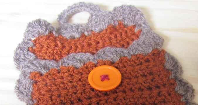 large image of art item: accessory – cell phone pocket brown gray button orange