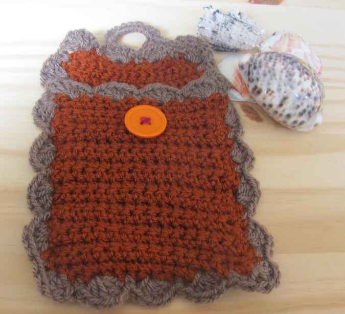 large image of art item: accessory – cell phone pocket brown gray button orange