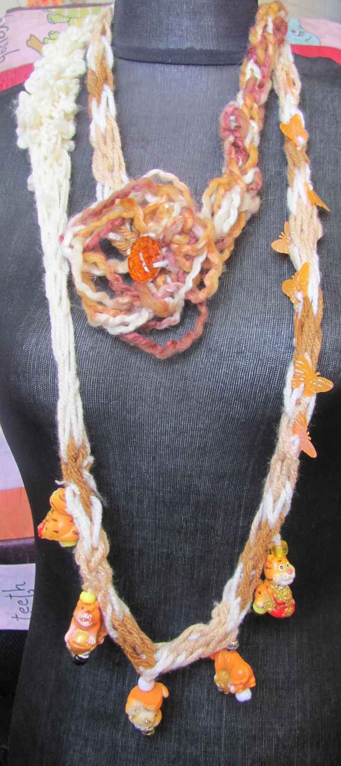 large image of art item: accessory – necklace crochet orange white flower animals wooden
