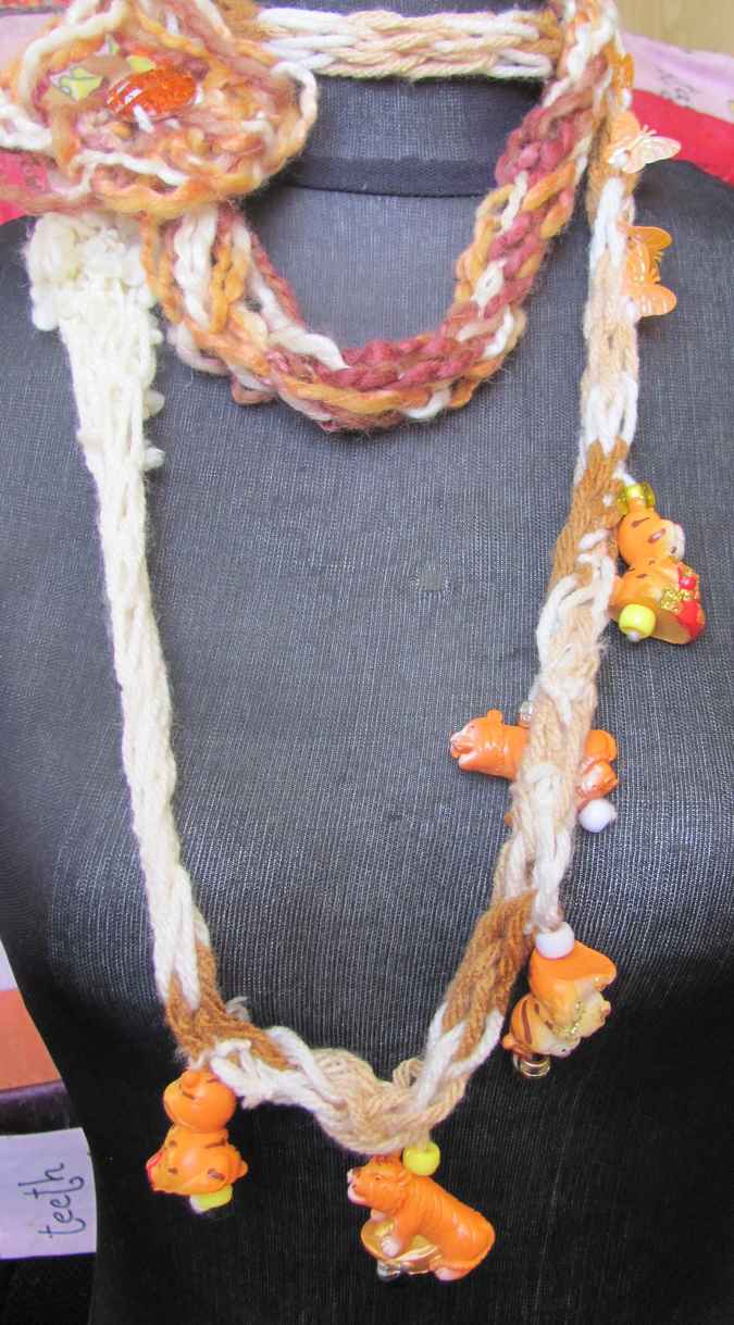large image of art item: accessory – necklace crochet orange white flower animals wooden