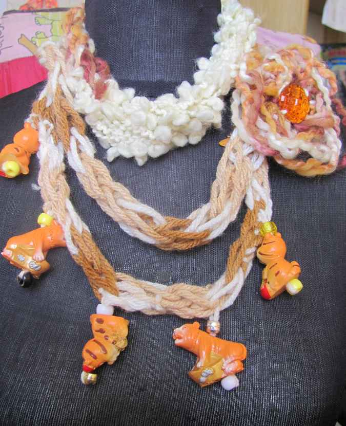 large image of art item: accessory – necklace crochet orange white flower animals wooden