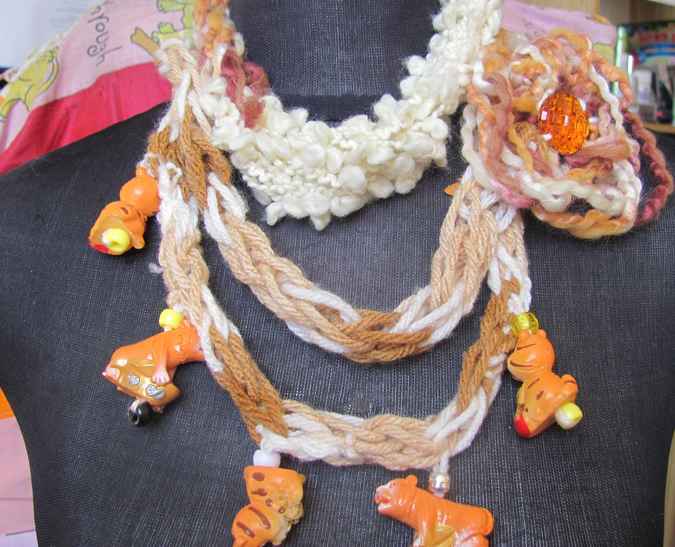 large image of art item: accessory – necklace crochet orange white flower animals wooden