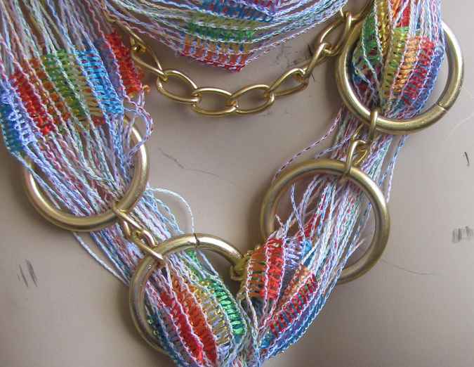 large image of art item: accessory – necklace rings golden threads colorful