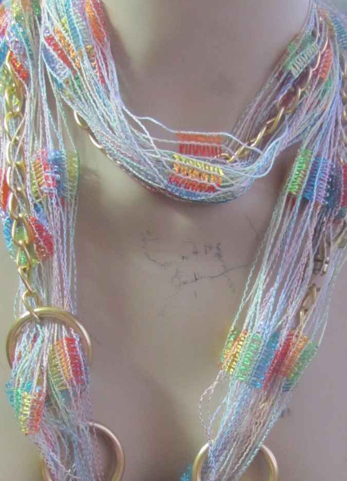 large image of art item: accessory – necklace rings golden threads colorful