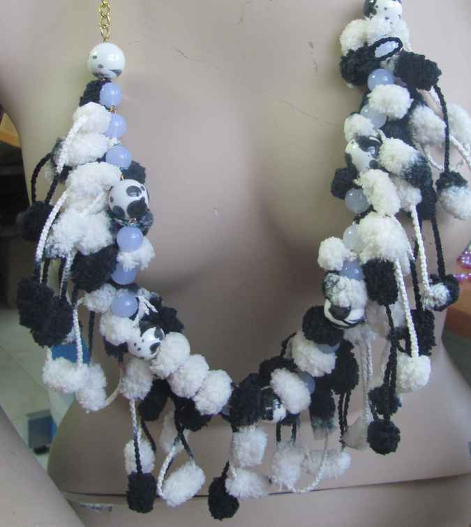 large image of art item: accessory – ponpons black and white golden chain