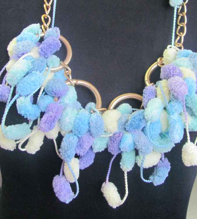 large image of art item: accessory – ponpons cyan golden chain and rings