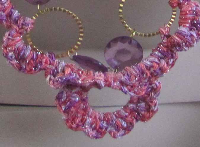 large image of art item: accessory – chestpiece necklace crochet pink rings gold