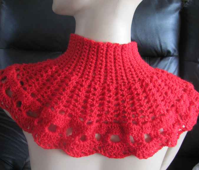 large image of art item: red crocheted capelet with golden button