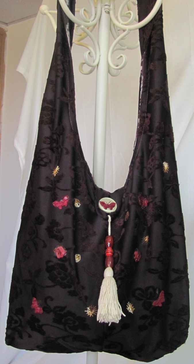 large image of art item: bag – brown motif flower black butterfly red
