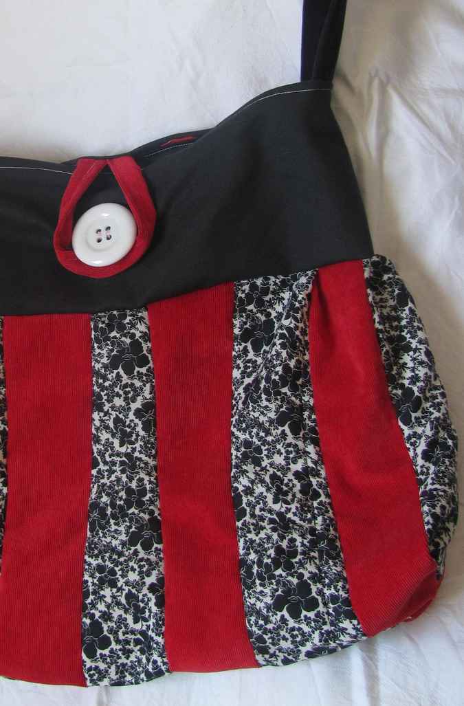 large image of art item: bag – black stripes red black button white