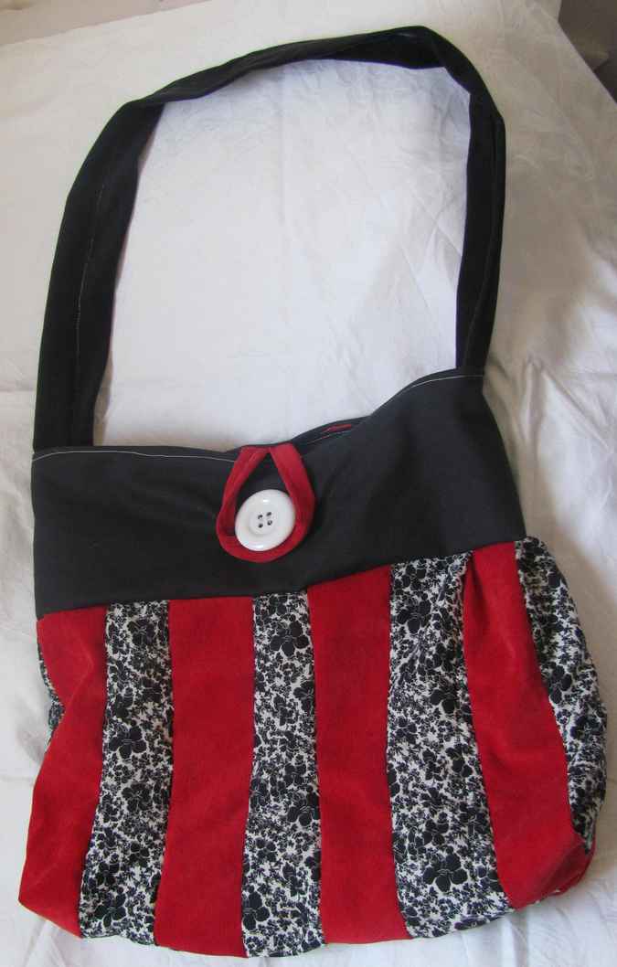 large image of art item: bag – black stripes red black button white