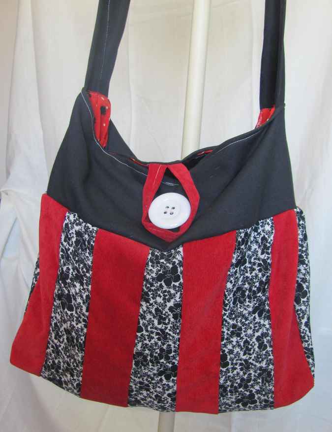 large image of art item: bag – black stripes red black button white