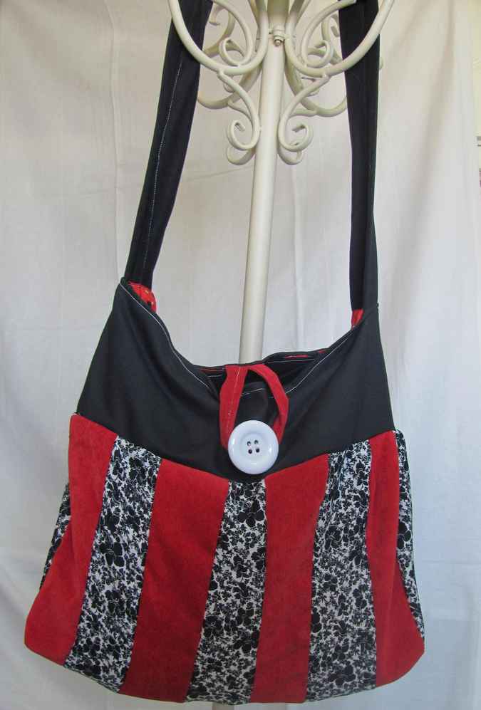large image of art item: bag – black stripes red black button white