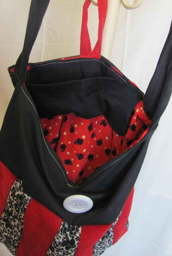 large image of art item: bag – black stripes red black button white