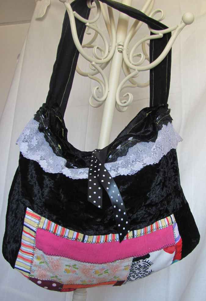 large image of art item: bag – black with white lace pink quiltwork and black and white ribbon
