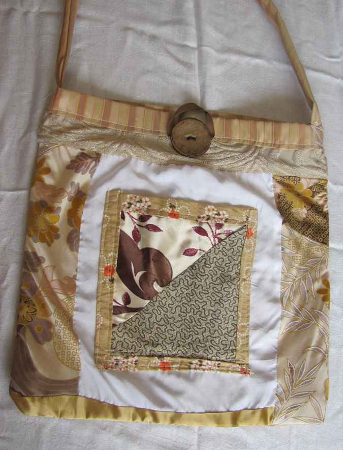 large image of art item: bag – button brown quiltwork