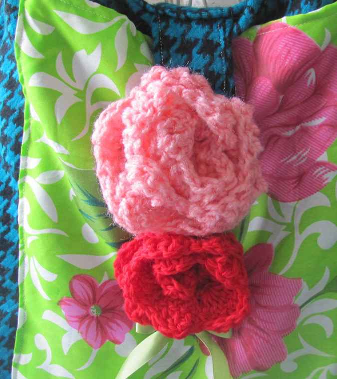 large image of art item: bag – checkred blue black motif leaves green white crochet flowers red pink