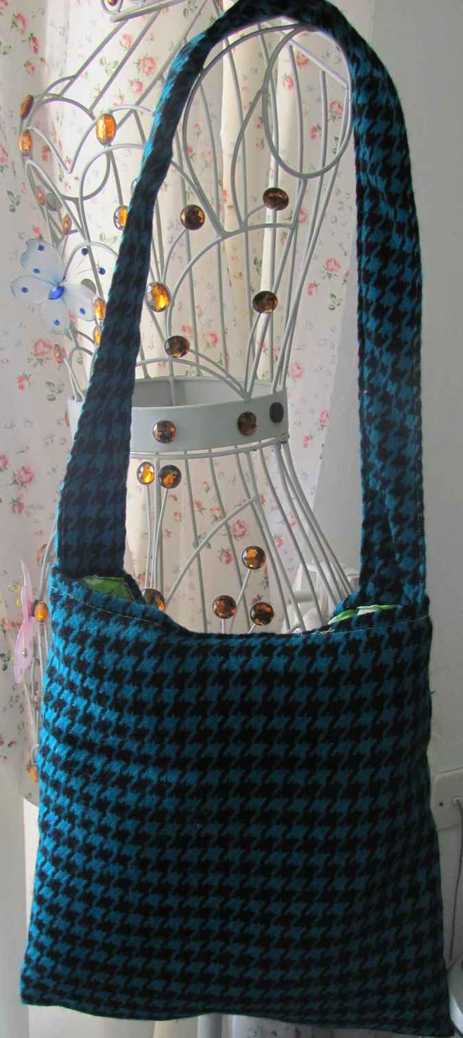 large image of art item: bag – checkred blue black motif leaves green white crochet flowers red pink