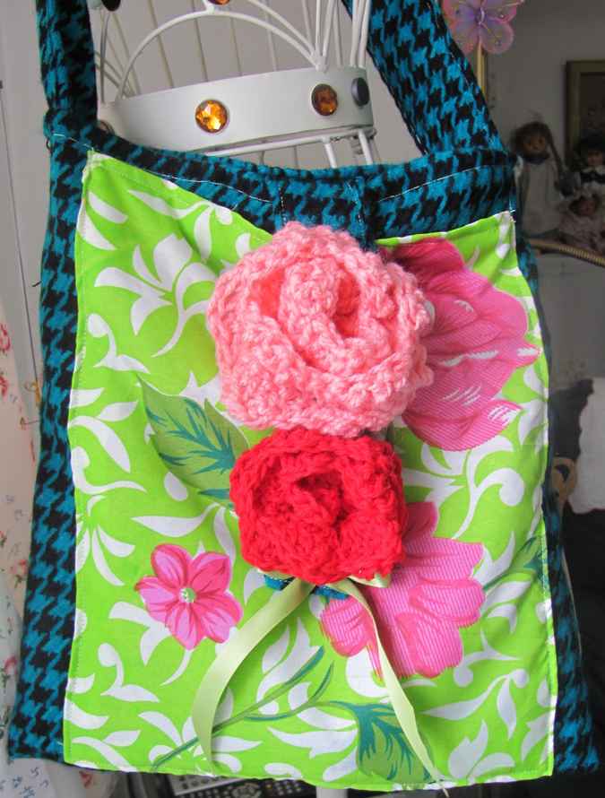 large image of art item: bag – checkred blue black motif leaves green white crochet flowers red pink