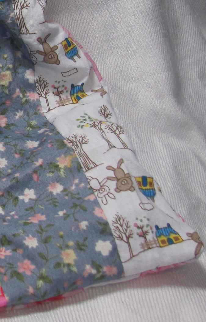 large image of art item: bag – doll and blue ribbon