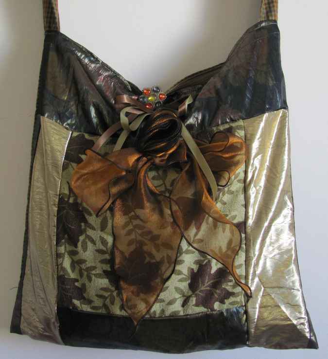 large image of art item: bag – gold with ribbons