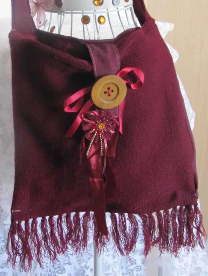 large image of art item: bag – fabric crimson button brown hairs