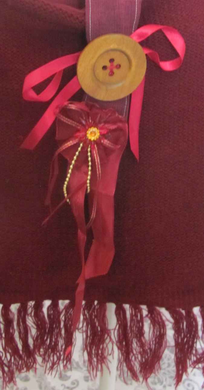 large image of art item: bag – fabric crimson button brown hairs