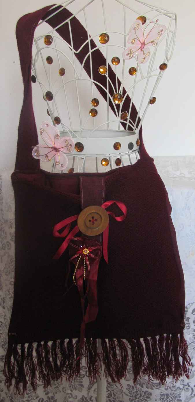 large image of art item: bag – fabric crimson button brown hairs