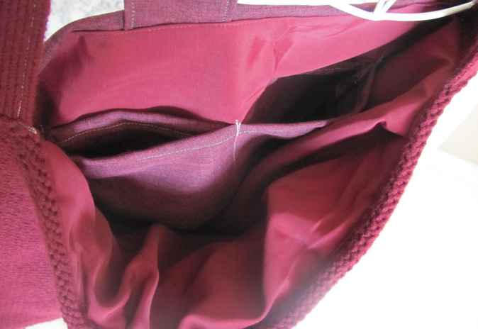 large image of art item: bag – fabric crimson button brown hairs