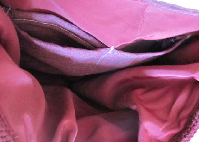 large image of art item: bag – fabric crimson button brown hairs