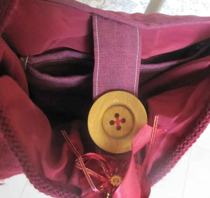 large image of art item: bag – fabric crimson button brown hairs