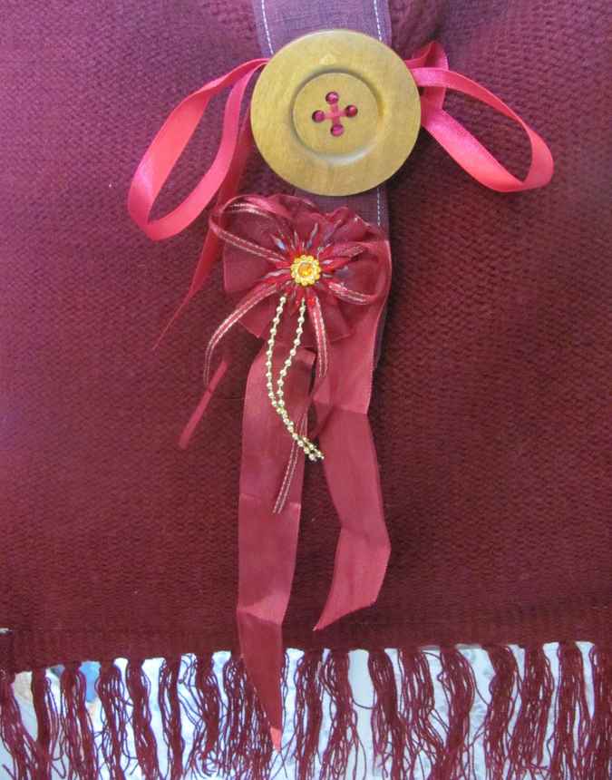 large image of art item: bag – fabric crimson button brown hairs