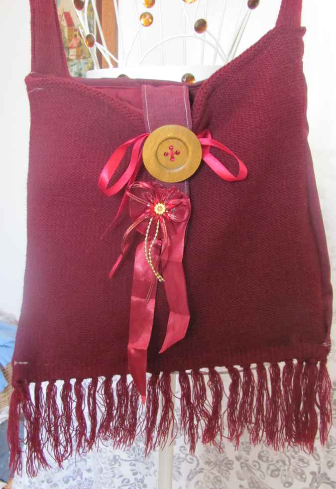 large image of art item: bag – fabric crimson button brown hairs