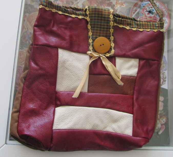 large image of art item: bag – leathery crimson button brown