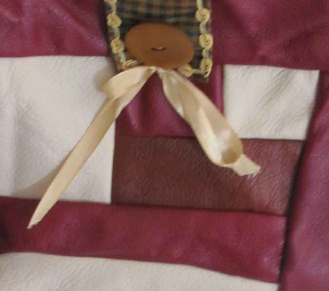 large image of art item: bag – leathery crimson button brown