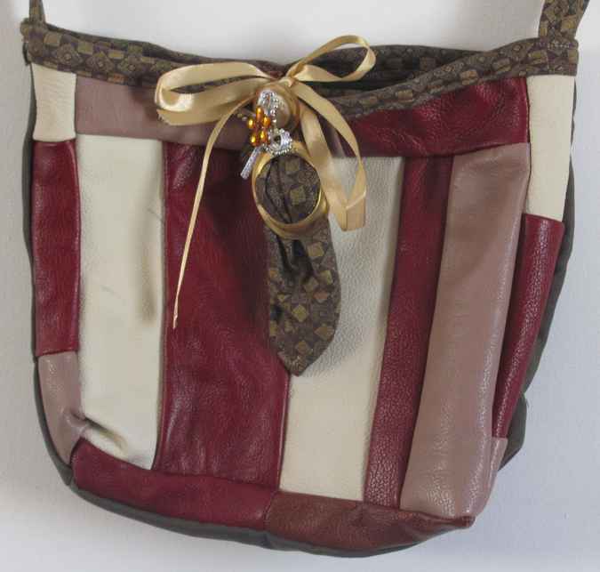 large image of art item: bag – leathery stripes crimson white ribbon