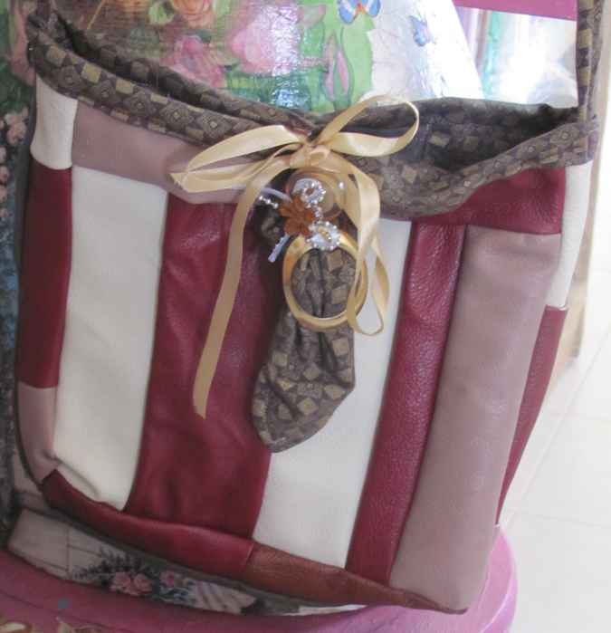 large image of art item: bag – leathery stripes crimson white ribbon