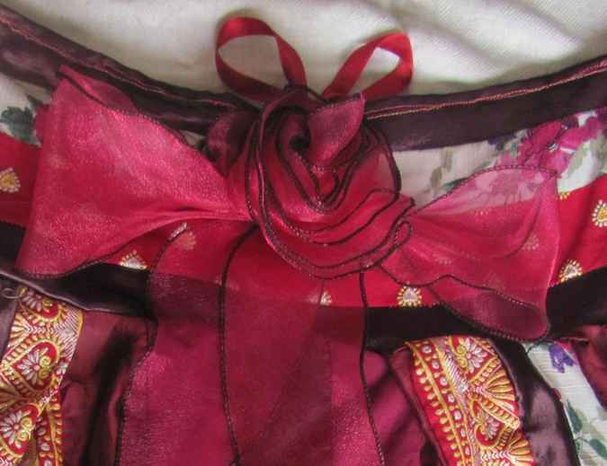large image of art item: bag – purple red white ribbon