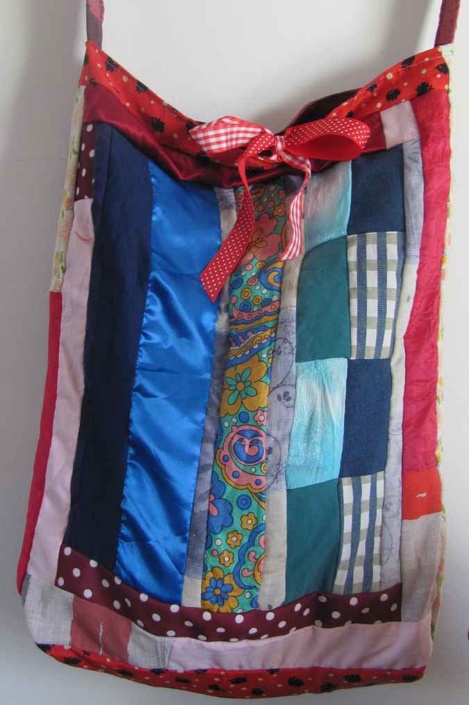 large image of art item: bag – quiltwork red blue with red ribbons